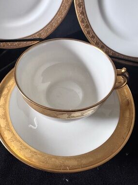 The GOA Limoges France 2 Handled Cup and Saucer in white with gold trim is a vin